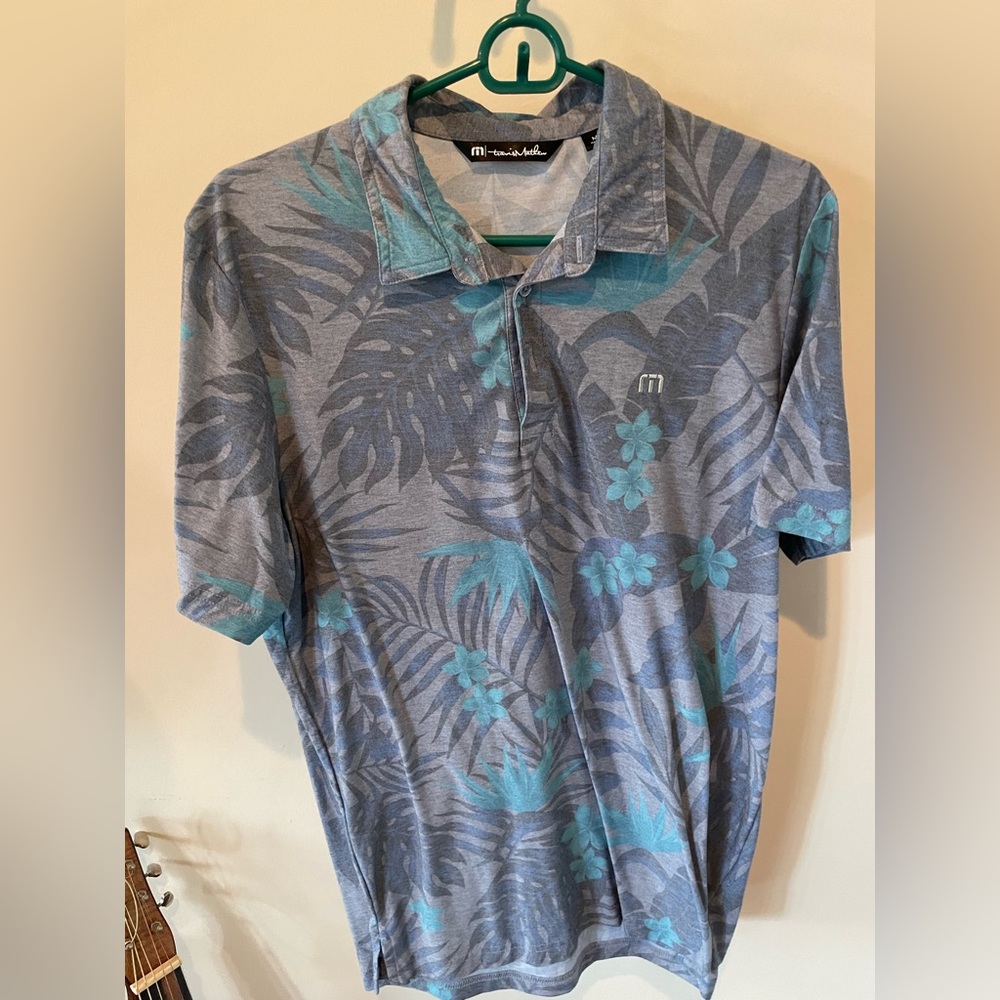 Travis Matthew’s polo/ gold shirt